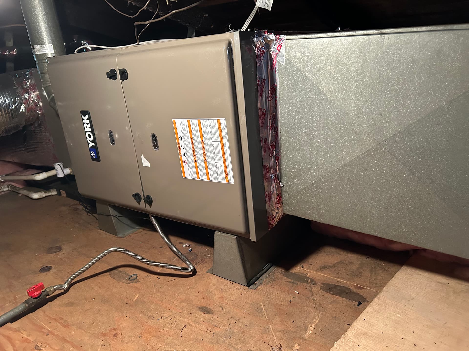 Rooftop AC and Indoor Furnace Working Together for Year-Round Comfort