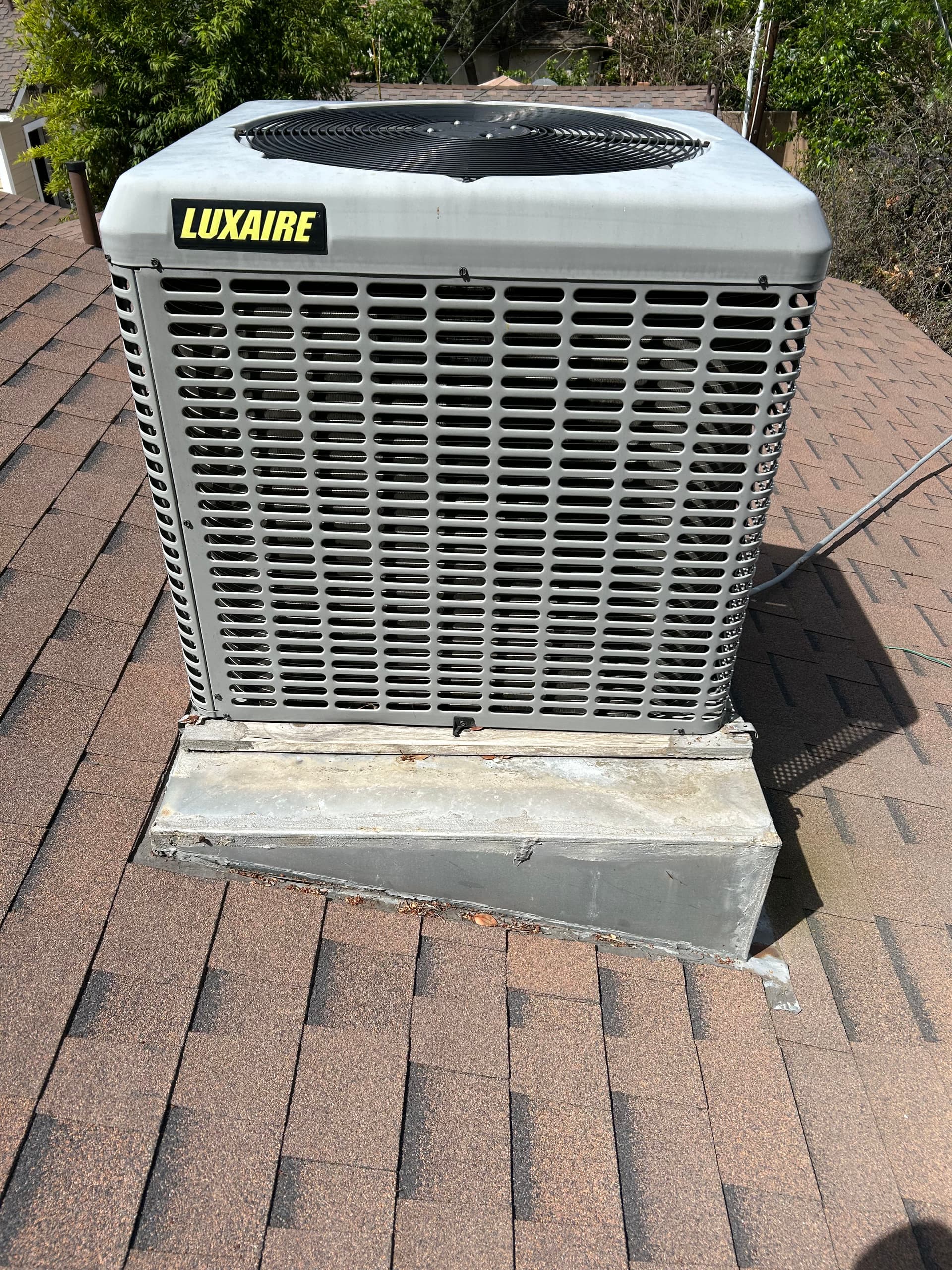 Rooftop AC and Indoor Furnace Working Together for Year-Round Comfort